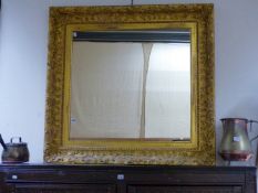 A 19TH.C.GILT FRAMED WALL MIRROR. 105CMS WIDE.