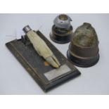 TWO WWI BATTLERFIELD RELICS, A GERMAN SHELL FUSE TIMER WITH LABEL THE CALVERT MENIN ROAD YPRES