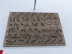 A MAYAN STYLE RAISED WOOLWORK PICTURE DEPICTING AGRICULTURAL ACTIVITIES.