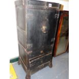 A 19TH CENTURY JAPANESE WOODEN SMALL CABINET WITH CUPBOARD AND DRAWERS DECORATED WITH SHAPED IRON