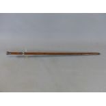 A LATE VICTORIAN SWORD STICK WITH SILVER HALLMARKED MOUNTS (LONDON 1900). NATURAL WOOD HANDLE AND