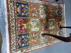 A PERSIAN RUG OF GARDEN DESIGN. 142 X 103CMS AND ANOTHER OF BIDJAR DESIGN (2)