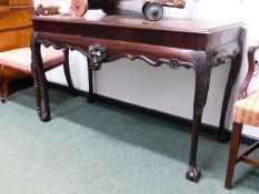 A 19TH C. MAHOGANY SERVING TABLE IN THE IRISH TASTE.