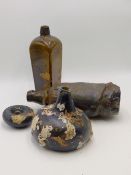 AN EARLY SHIPWRECK FOUND ONION FORM BOTTLE WITH BARNACLE ENCRUSTATION, TWO FURTHER BOTTLES,ETC.