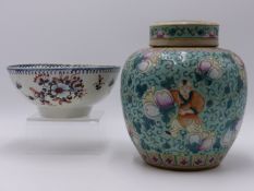 A CHINESE EXPORT FAMILLE ROSE COVERED GINGER JAR WITH FIGURAL DECORATION AND ENCIRCLED RING MARK