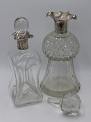 A CUT GLASS DECANTER AND STOPPER WITH A SILVER HALLMARKED COLLAR AND FLUTED NECK, TOWN MARK LONDON