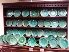 AN EXTENSIVE COLLECTION OF VICTORIAN AND LATER GREEN GLAZE LEAF DECORATED POTTERY BY WEDGWOOD AND