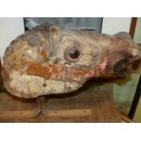 A LATE 19TH.C.CARVED WOOD CAROUSEL HORSE'S HEAD WITH REMNANTS OF ORIGINAL PAINT, NOW MOUNTED ON