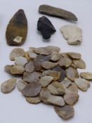 A COLLECTION OF EARLY KNAPPED FLINT AND STONE ARTIFACTS TO INCLUDE SPEAR HEAD, TWO SHAPED HAND