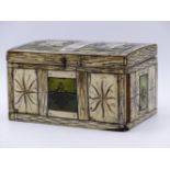 A SMALL 19TH.C.BONE MOUNTED CASKET WITH GREEN STAINED AND ENGRAVED DECORATION. 14CMS WIDE.