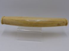 A FINELY CARVED EARLY 20TH. CENTURY SCRIMSHAW IVORY TUSK CARVED IN RELIEF WITH POLAR BEAR,