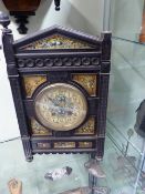 A 19TH.C.AESTHETIC MOVEMENT BRACKET OR MANTLE CLOCK WITH EBONISED CASE INSET WITH HAND PAINTED