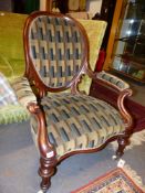 A GOOD VICTORIAN MAHOGANY CARVED SHOW FRAME SALON ARMCHAIR.