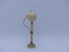 A 19TH.C.TURNED IVORY BILBOQUET CUP AND BALL GAME.