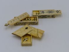 A 19TH.C.SET OF CARVED BONE MINIATURE DOMINOES IN A SLIDING TOP BOX, STIPPLE ENGRAVED WITH THE