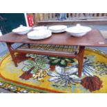 A MID 20TH.CENTURY TEAK COFFEE TABLE WITH CANED UNDERTIER. 120CMS.WIDE