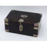 A TORTOISE SHELL HINGED BOX WITH WHITE METAL BOUND CORNERS AN INITIAL PLATE AND A LOCKING HASP.