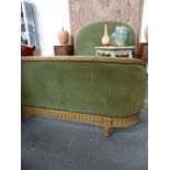 A FRENCH DOUBLE BED WITH CARVED AND PAINTED SHOW FRAME.