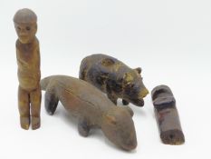 AN INTERESTING NAIVE CARVED TRIBAL? MODEL OF AN OTTER. 19TH CENTURY 21CMS LONG TOGETHER WITH TWO