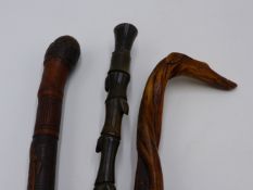 A 19TH CENTURY ORIENTAL CARVED BAMBOO WALKING STICK, A FOLK ART ENGLISH EXAMPLE WITH CARVED DOG'S