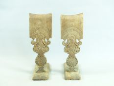 A PAIR OF ANTIQUE CARVED TREEN DISTAFFS EACH WITH PIN WHEEL AND GEOMETRICAL DESIGNS. 50CMS HIGH.