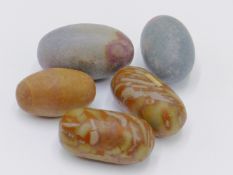 FIVE INDIAN SHIVA LINGAM STONES TO INCLUDE A PAIR OF POLISHED GREEN/YELLOW STONE EXAMPLES, TWO