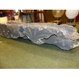 AN EARLY CARVED STONE GOTHIC STYLE DOWNSPOUT IN THE FORM OF A GARGOYLE OR DRAGON. 127CMS. LONG