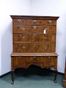 AN 18TH.C.AND LATER WALNUT AND CROSS BANDED CHEST OF DRAWERS ON ON THREE DRAWER BASE STAND RAISED ON