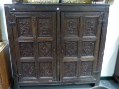 AN ANTIQUE 17TH.C.AND LATER OAK TWO PANELLED DOOR CUPBOARD. 149CMS WIDE