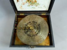 A 19TH CENTURY WALNUT CASED POLYPHON DISK MUSIC BOX FOR 11" DISCS. CONDITION REPORT:- THE CASE IN