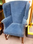 AN ANTIQUE EARLY GEORGIAN STYLE HIGH WING BACK ARMCHAIR.