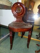 A PAIR OF GOOD EARLY 19TH.C.MAHOGANY HALL CHAIRS WITH ROUNDEL BACKS AND PAINTED CREST DECORATION.