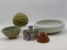 AN EARLY CHINESE CELEDON GLAZED SMALL BOWL, A WHITE GLAZED THREE FOOTED SHALLOW BOWL AND OTHER
