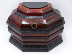 A RED TORTOISE SHELL CADDY WITH EBONY BOLLECTION AND RIPPLE MOULDINGS. (APPROX WIDTH 29 CMS).