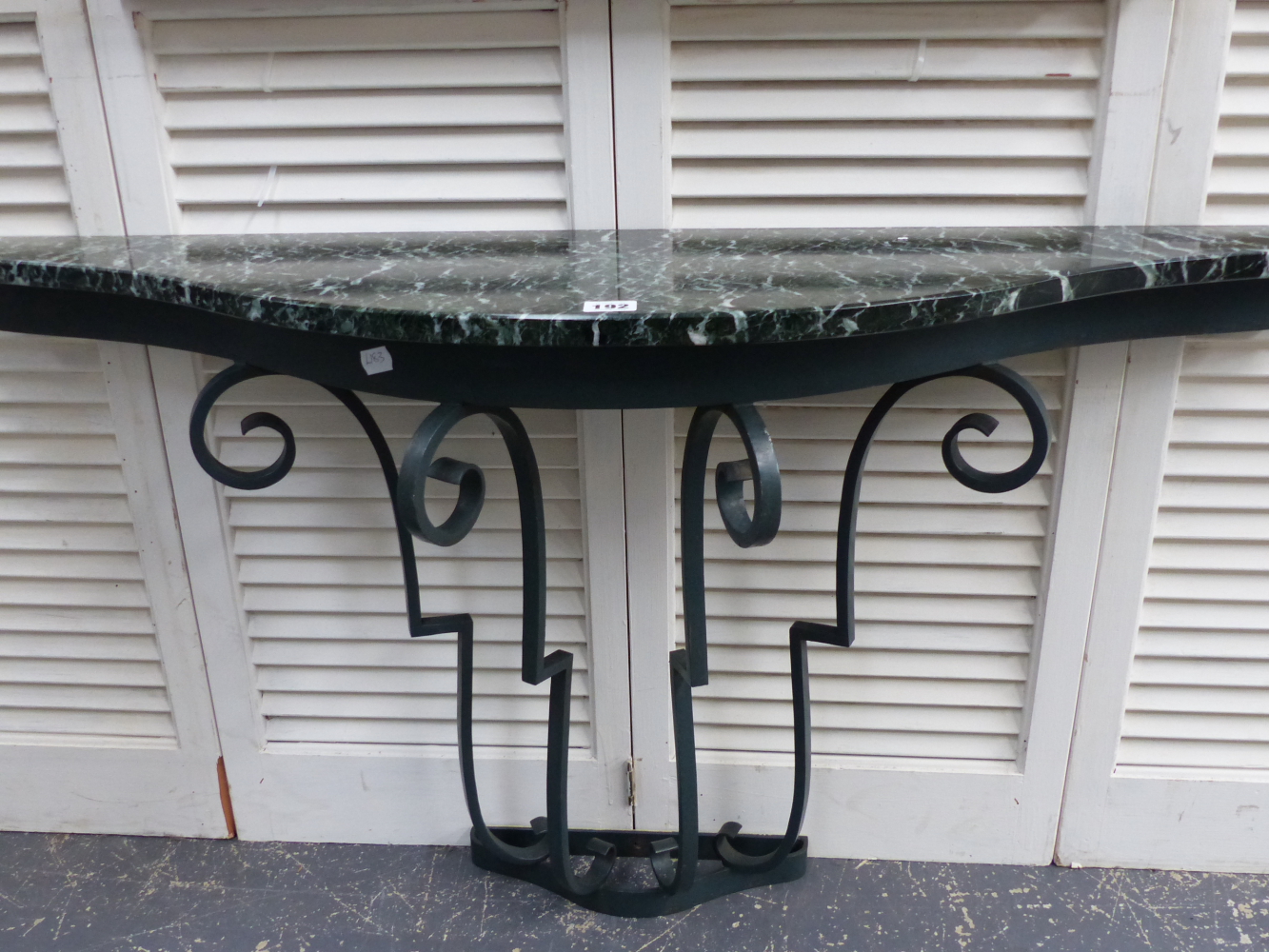 A SHAPED MARBLE TOP AND WROUGHT IRON 1930'S DESIGN CONSOLE TABLE. 114CMS. WIDE X 62CMS. HIGH