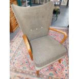 A GOOD MID CENTURY HOWARD KEITH "BAMBINO" CHAIR WING ARMCHAIR WITH HK LABEL.