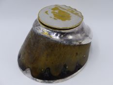 A LATE 19TH CENTURY SILVER PLATE MOUNTED HORSE'S HOOF INKWELL, THE HINGED COVER NAMED GAMECOCK AND