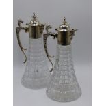 A PAIR OF SILVER MOUNTED CUT GLASS CLARET JUGS, HALLMARKED SHEFFIELD, CIRCA 1991. 30CMS HIGH.