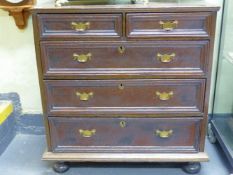 AN 18TH.C.OAK SMALL CHEST OF TWO SHORT AND THREE LONG DRAWERS. 79CMS WIDE.
