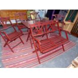 A VINTAGE FOLDING HARDWOOD PATIO TABLE, FOUR CHAIRS AND A BENCH.