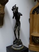 AN UNUSUAL PATINATED GARDEN FIGURE OF AN IMP. 82CMS HIGH OVERALL.