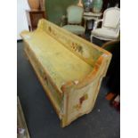 A CONTINENTAL PAINT DECORATED BOX SEAT SETTLE. 152CMS.WIDE.