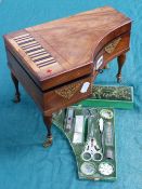 AN EARLY 19TH.C. MAHOGANY SEWING BOX IN THE FORM OF A GRAND PIANO AND WITH MUSICAL MOVEMENT WITH