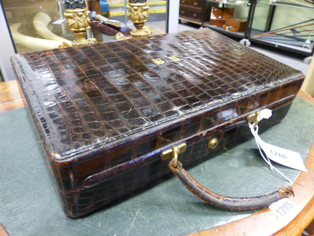 A SMALL CROCODILE SKIN DRESSING CASE WITH BRAMAH LOCK. (WIDTH 38 CMS.).