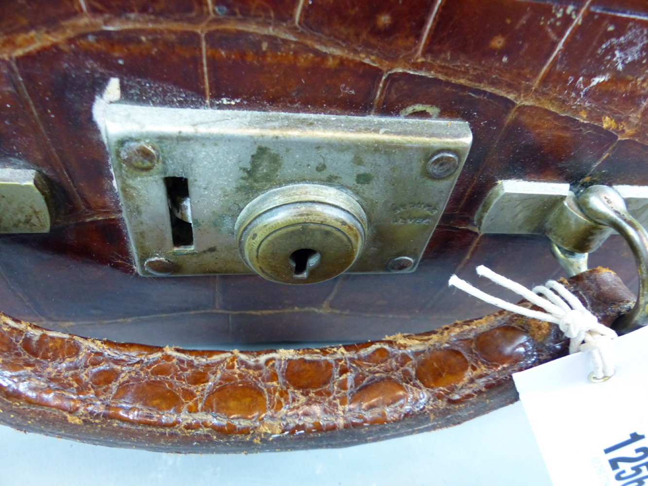 A CROCODILE SKIN TRAVELLING VANITY CASE FITTED WITH VARIOUS GLASS AND WHITE METAL DRESSING TABLE - Image 9 of 10