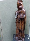 A CARVED OAK LARGE FIGURE OF THE MADONNA AND CHILD. 63CMS HIGH.