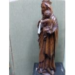 A CARVED OAK LARGE FIGURE OF THE MADONNA AND CHILD. 63CMS HIGH.