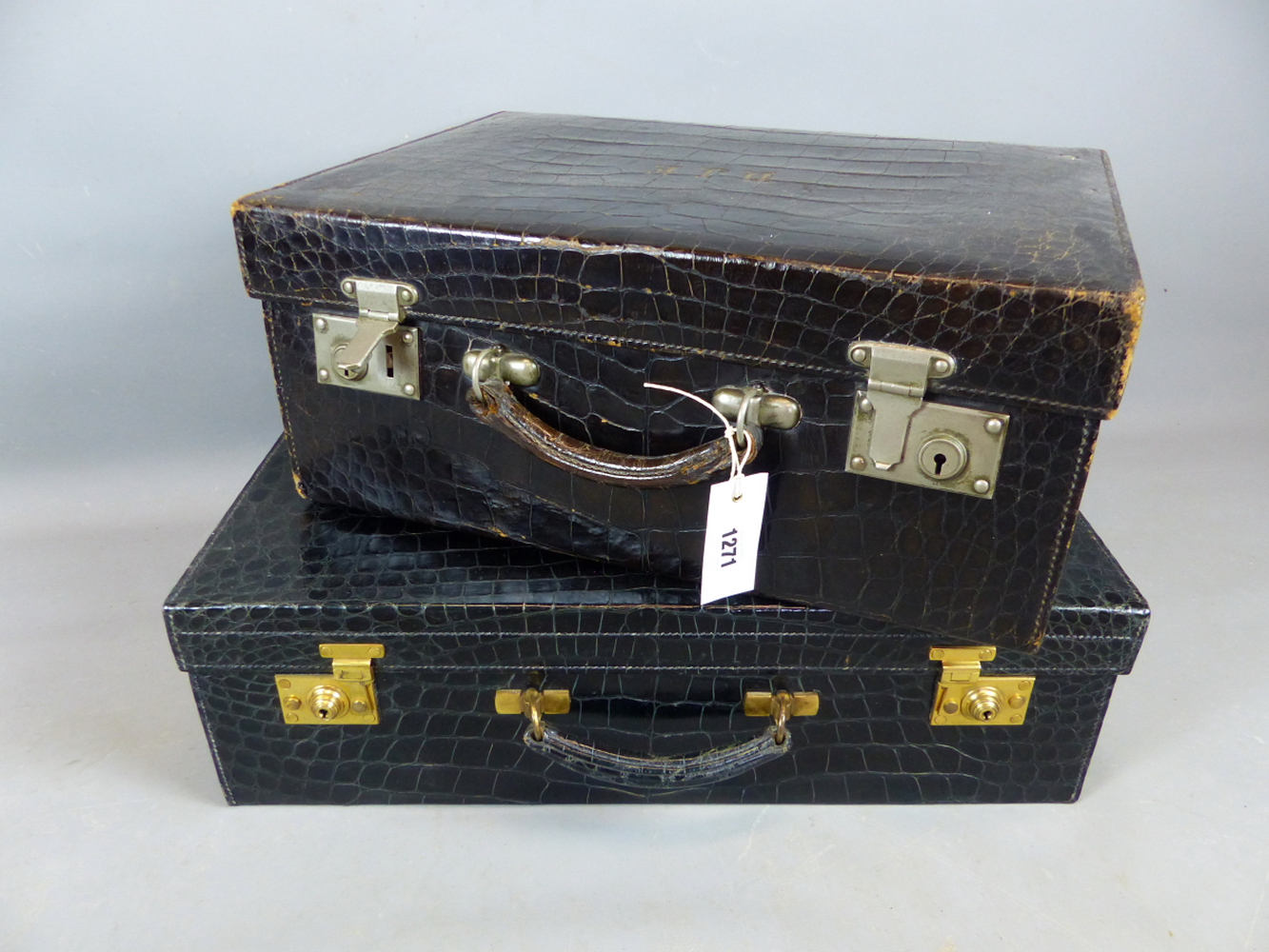 A GOOD ASPREY LONDON CROCODILE SKIN SUITCASE WITH GILT BRASS FITTINGS TOGETHER WITH A SMALLER