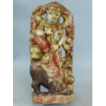 AN EASTERN CARVED AND POLYCHROME MARBLE FIGURAL GROUP OF A DEITY AND ANIMALS WITH GILT HIGHLIGHTS.