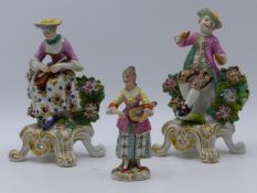 A PAIR OF CHELSEA STYLE PORCELAIN FIGURES, A BOY PLAYING CYMBALS AND A GIRL PLAYING A LUTE,